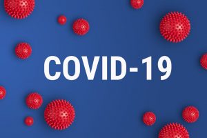 Inscription COVID-19 on blue background. World Health Organization WHO introduced new official name for Coronavirus disease named COVID-19